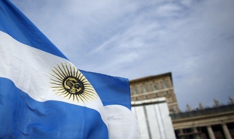 An Argentine national flag flutters in the wind, in front of the future private apartment of Pope Francis at the Vatican on March 17, 2013. 