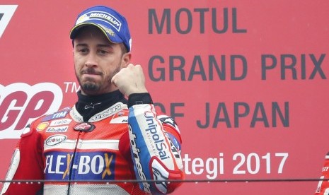 Andrea Dovizioso meraih podium juara di GP Jepang, Ahad (15/10).