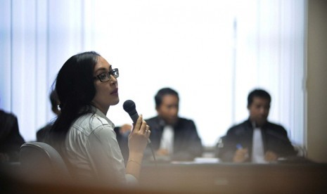 Angelina Sondakh attends her first trial at Anti-corruption Court in Jakarta on Thursday.  