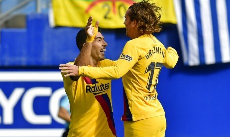 Antoine Griezmann (kanan) dan Luis Suarez.