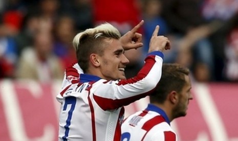 Antoine Griezmann merayakan golnya ke gawang Elche.