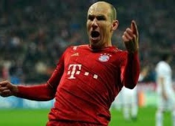 Arjen Robben mengekpresikan kegembiraannya usai mencetak gol ke gawang FC Basel dalam leg kedua Liga Champions, Rabu (14/3) dini hari WIB. Dalam laga itu Munich menang 7-0 sekaligus berhak melangkah ke babak perempat final.