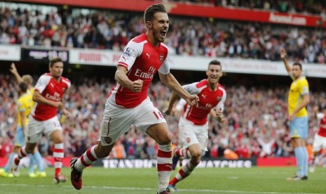 Arsenal's Aaron Ramsey celebrates after scoring a goal against Crystal Palace during the English Premier League soccer match at the Emirates stadium in London August 16, 2014