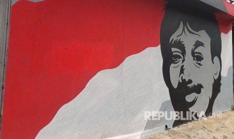 Mural wajah Munir di salah satu gang di Jalan Raya Puspitek, Pamulang, Tangerang Selatan.