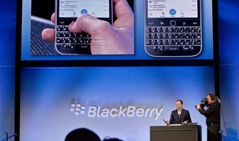 BlackBerry's director of marketing and enterprise Jeff Gadway demonstrates the company's new phone the BlackBerry Classic, during a news conference, Wednesday, Dec. 17, 2014, in New York. 