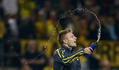 Borussia Dortmund Ciro Immobile celebrates after defeating Arsenal in their Champions League group D soccer match in Dortmund September 16, 2014.