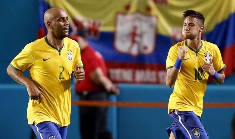  Brazil striker Neymar Junior celebrates his game winning goal with Maicon (2) against Columbia n the second half at Sun Life Stadium. Brazil won 1-0.