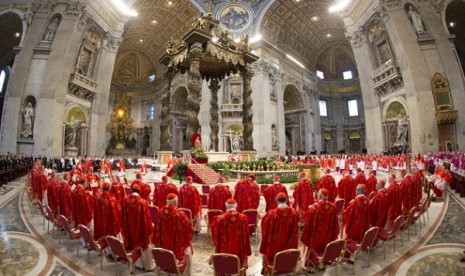 Cardinals attend a Mass for the election of a new pope celebrated by Cardinal Angelo Sodano inside St. Peter's Basilica, at the Vatican, Tuesday, March 12, 2013. 