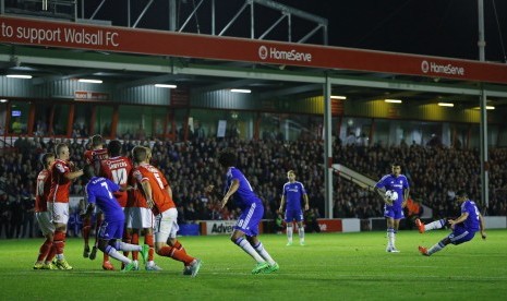 Chelsea's Radamel Falcao slips as he takes a free kick