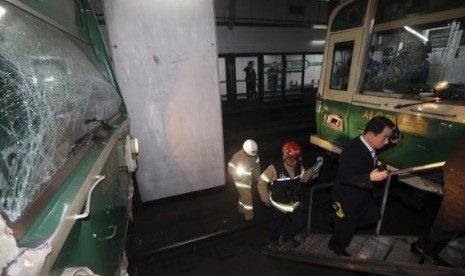 Damaged subway trains are seen at a subway station in Seoul May 2, 2014.