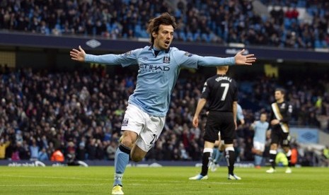   David Silva meluapkan kegembiraan usai menceploskan bola ke gawang Fulham dalam pertandingan lanjutan English Premier League, Sabtu (19/1/2013) di Etihad Stadium. 