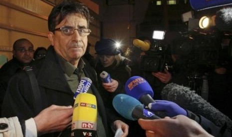 Deputy director Jean Marc Grenier talks to media outside the CHU Nord hospital in Grenoble, French Alps, where retired seven-times Formula One world champion Michael Schumacher is hospitalized after a ski accident, December 29, 2013.