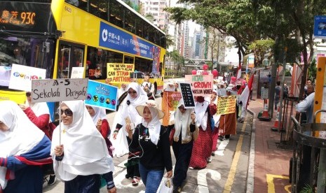 Dompet Dhuafa dan Pekerja Migran Indonesia (PMI) di Hong Kong pawai menyambut Ramadhan pada Ahad (28/4). 