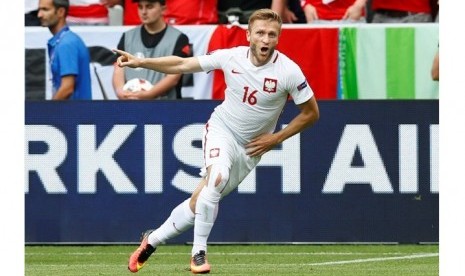 Ekspresi gelandang Polandia Jakub Blaszczykowski usai membobol gawang Swiss.