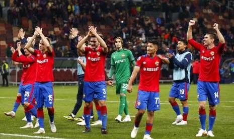 Ekspresi kegembiraan para pemain CSKA Moskow setelah menaklukkan Real Madrid 1-0 di Liga Champions.