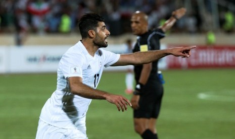 Ekspresi pemain Iran Mehdi Taremi seusai mencetak gol ke gawang Uzbekistan.