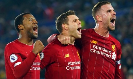 Ekspresi tiga pemain Liverpool usai meraih kemenangan.