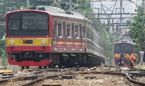 Electric train services (KRL) Commuter Line passing Manggarai Station, Jakarta.