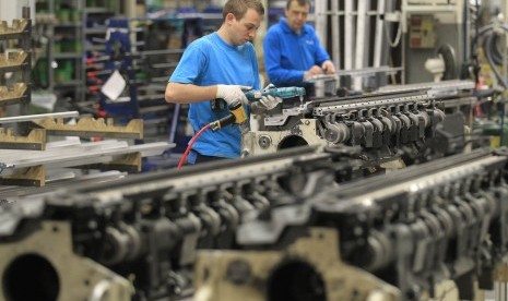 Employees at Belgian company Picanol works on the construction of weaving machines at the factory's plant in Ypres. Picanol, a leading exporter of the weaving machines, is reliant on countries outside Europe for its growth as Belgium and the euro zone stru