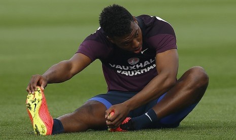 England's Daniel Sturridge stretches during a training session at the St George's Park training complex near Burton-upon-Trent, central England, September 5, 2014