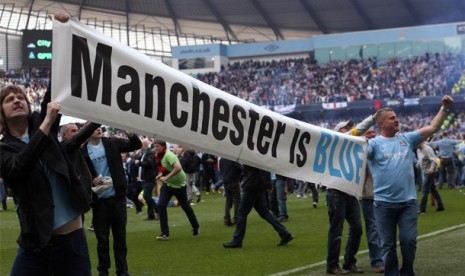 Fans merayakan kemenangan Manchester City.