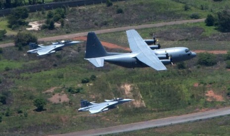 Fighter jets escort the military plane carrying the coffin of former South African President Nelson Mandela as it is flown to Mandela's home in the village of Qunu, Eastern Cape in this December 14, 2013 handout picture provided by the South African Govern