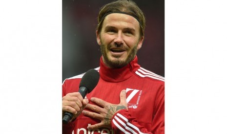 Former British soccer player David Beckham delivers a speech prior to the UNICEF Match For Children soccer match Great Britain & Ireland against the 'Rest Of The World' at Old Trafford, Manchester, Britain, 14 November 2015.