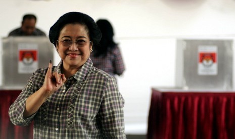 Former president Megawati votes during local elections to choose governor of Jakarta, recently.   