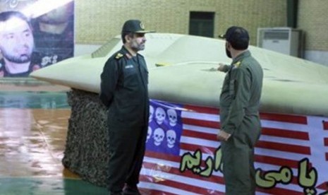 Foto yang dirilis Garda Revolusi Iran menunjukkan pesawat mata-mata AS RQ-170 Sentinel yang diklaim ditembak jatuh tentara Iran.