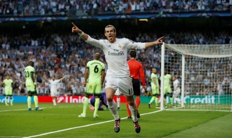 Gareth Bale merayakan gol kemenangan Real Madrid atas Manchester City.