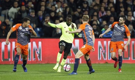 Gelandang Lile, Nicolas Pepe (tengah).