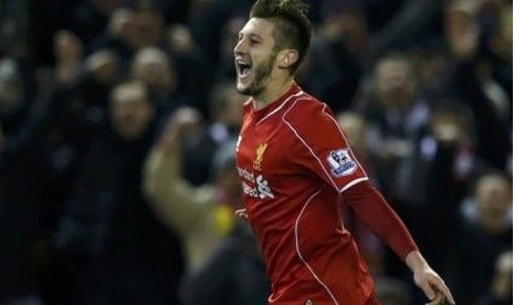 Gelandang serang Liverpool Adam Lallana merayakan golnya ke gawang Swansea City dalam lanjutan Liga Primer Inggris, Selasa (30/12) WIB.