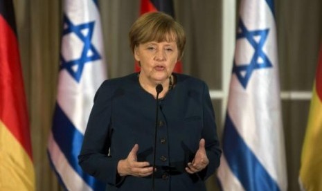 German Chancellor Angela Merkel speaks during her meeting with Israeli Prime Minister Benjamin Netanyahu at the Prime minister's residence in Jerusalem February 24, 2014.