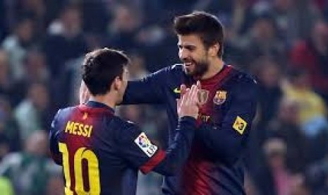 Gerrard Pique dan Lionel Messi