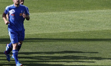 Greece's Sokratis Papastathopoulos runs during a training session at the Euro 2012 soccer championship in Legionowo, about 25 kilometers (15 miles) north of Warsaw, Poland on Wednesday, June 13, 2012. 