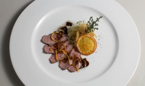 Grilled Pink Duck breast served with Orange-Charlotte Gravy on Fennel Comfit