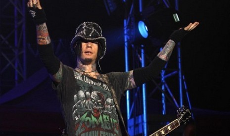 Guns N' Roses guitarist DJ Ashba reacts to the crowd as he performs during a concert in Bangalore, India. 