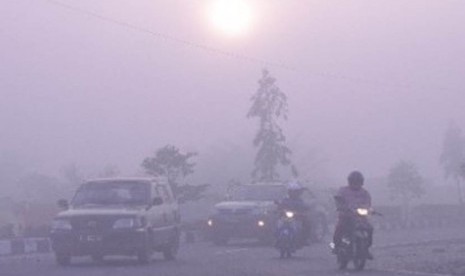 Haze limits visibility in some area in Indonesia forest fire or land clearing using fire, last year.