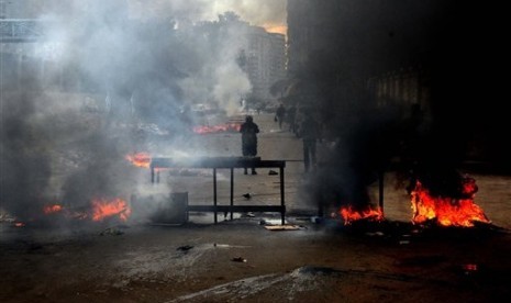 Heavy smoke billows the air due to clashes between supporters of Egypt’s ousted Islamist President Mohammed Morsi and security forces in Mediterranean city of Alexandria, Egypt, Friday, Jan. 3, 2014. 