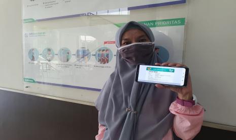 Hilmiyati (39 tahun), salah satu peserta Pekerja Bukan Penerima Upah (PBPU) atau peserta mandiri, tetap rutin membayar iuran meski belum pernah menggunakan layanan BPJS Kesehatan hingga saat ini.