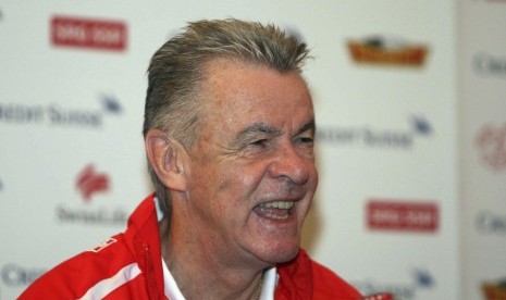 Hitzfeld, coach of the Swiss national soccer team, smiles during a news conference in Tirana