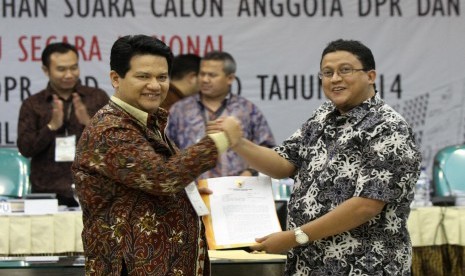 Husni Kamil Manik (kiri) bersama Muhammad 