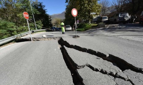 Street cracks following an earthquake. (Illustration)