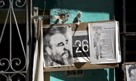 Images of Cuba's former leader, Fidel Castro, adorn a wall of a home in Havana, Cuba, Wednesday, Aug. 28, 2013.