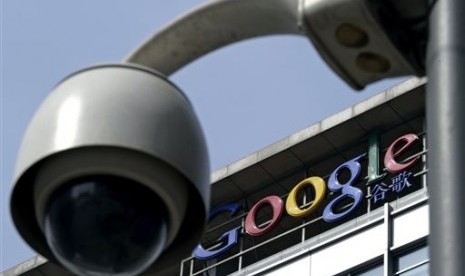 In this March 23, 2010 file photo, a surveillance camera is seen in front of the Google China headquarters in Beijing, China. 