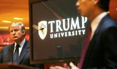 In this May 23, 2005 file photo, real estate mogul and Reality TV star Donald Trump, left, listens as Michael Sexton introduces him at a news conference in New York where he announced the establishment of Trump University. 