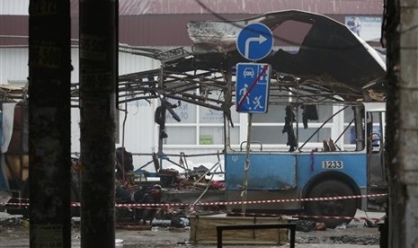 In this Monday, Dec. 30, 2013 file photo bodies of victims of a suicide bombing lie in what left of a trolleybus in downtown Volgograd, southern Russia. 