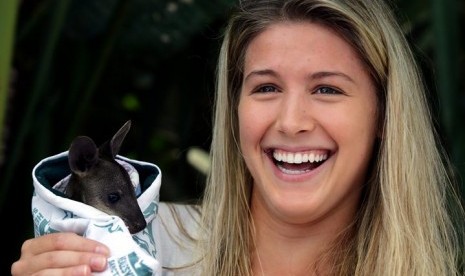 In this photo released by Tennis Australia, Eugenie Bouchard of Canada holds a baby wwallaby in the players lounge at the Australian Open tennis championship in Melbourne, Australia, Wednesday, Jan. 22, 2014. Bouchard will play China's Li Na in a semifinal