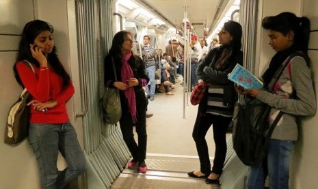 Indian women travel inside a Women Only metro train compartment in New Delhi, India, Saturday, Feb. 2, 