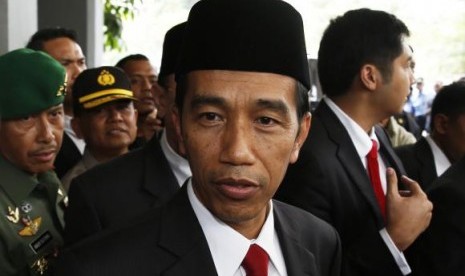 Indonesia's President-elect Joko Widodo looks on after a ceremony inaugurating a new parliament in Jakarta, October 1, 2014. 